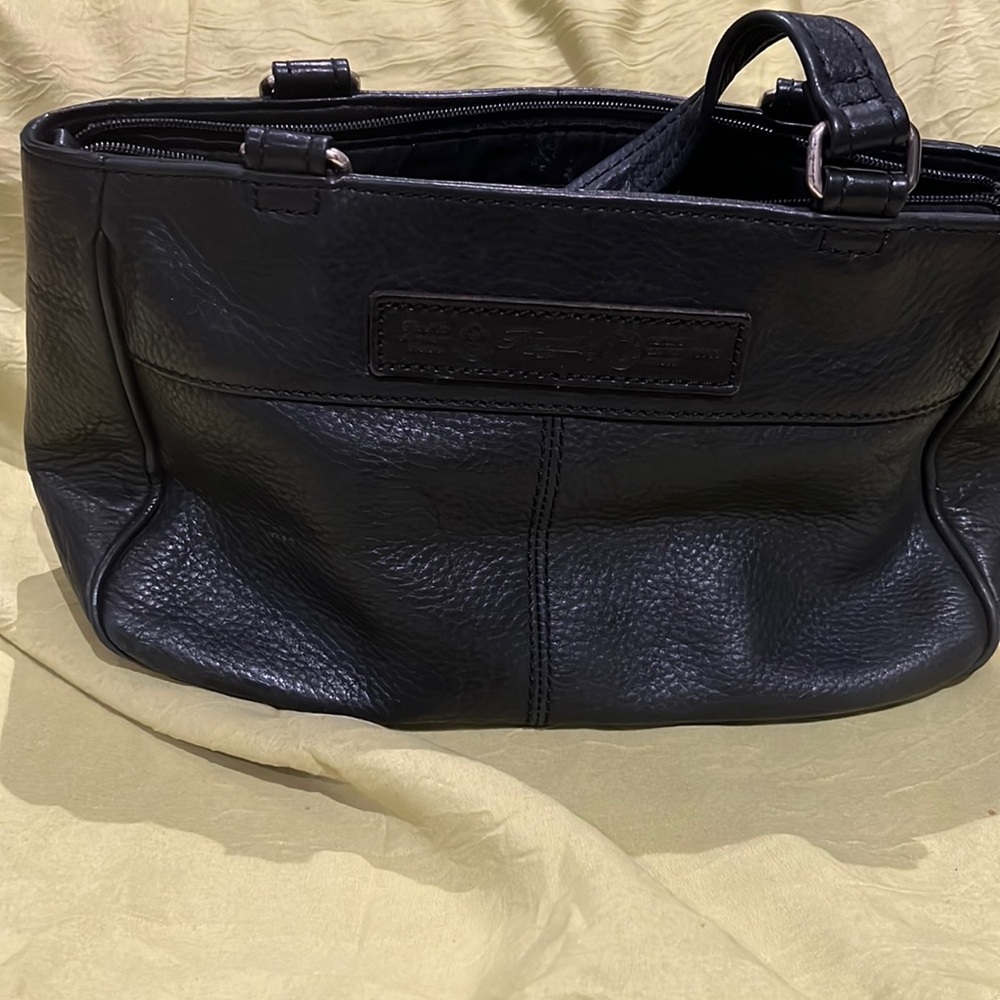 Fossil leather hand bag, 7 inch deep,4 inch width, 11 inch length.